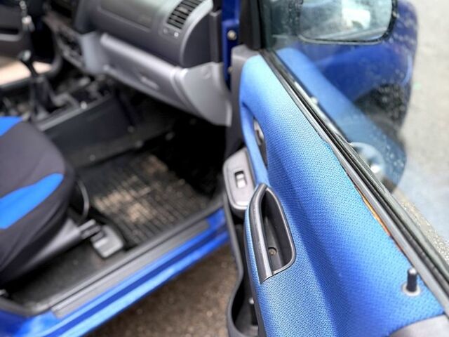 Синий Сузуки Игнис, объемом двигателя 1.3 л и пробегом 250 тыс. км за 3300 $, фото 7 на Automoto.ua