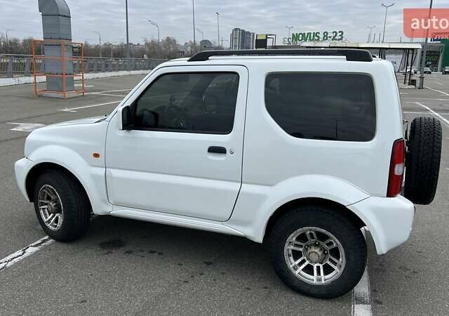 Белый Сузуки Джимни, объемом двигателя 1.3 л и пробегом 81 тыс. км за 9300 $, фото 2 на Automoto.ua