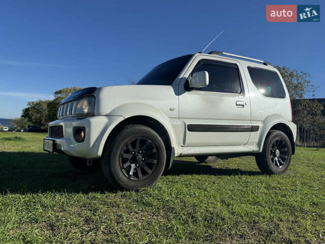 Білий Сузукі Джімні, об'ємом двигуна 1.33 л та пробігом 72 тис. км за 13400 $, фото 11 на Automoto.ua