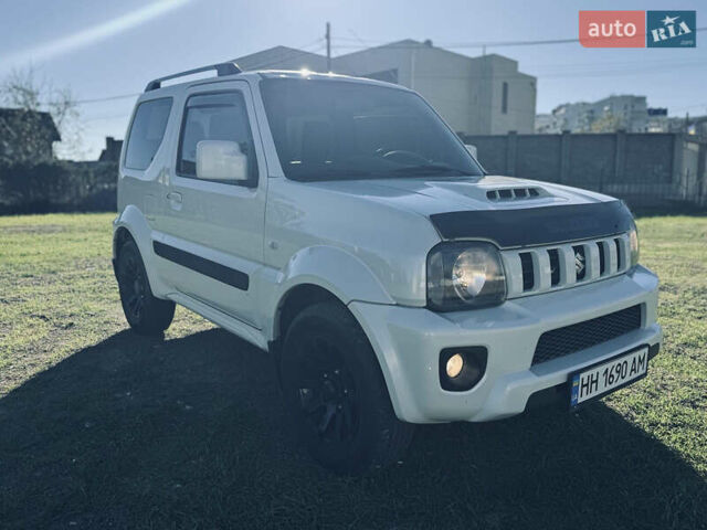 Білий Сузукі Джімні, об'ємом двигуна 1.33 л та пробігом 72 тис. км за 13400 $, фото 10 на Automoto.ua