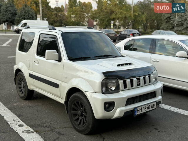 Білий Сузукі Джімні, об'ємом двигуна 1.33 л та пробігом 72 тис. км за 13400 $, фото 25 на Automoto.ua