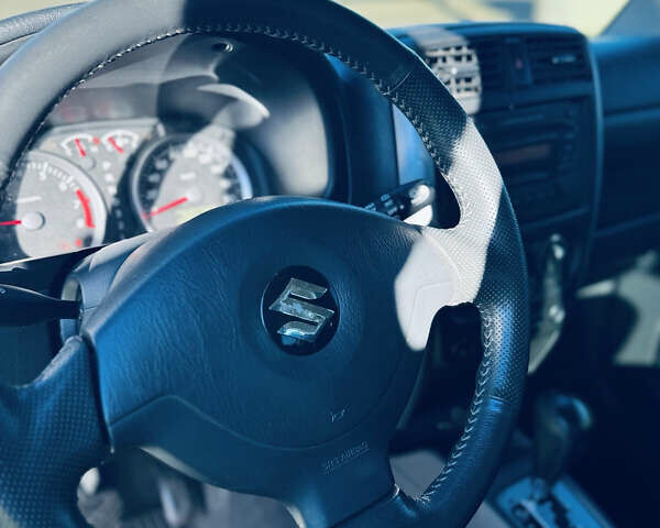 Білий Сузукі Джімні, об'ємом двигуна 1.33 л та пробігом 72 тис. км за 13400 $, фото 19 на Automoto.ua