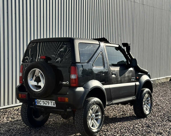 Черный Сузуки Джимни, объемом двигателя 1.3 л и пробегом 100 тыс. км за 7200 $, фото 9 на Automoto.ua