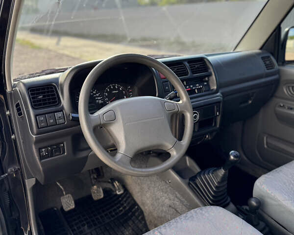 Черный Сузуки Джимни, объемом двигателя 1.3 л и пробегом 100 тыс. км за 7200 $, фото 14 на Automoto.ua