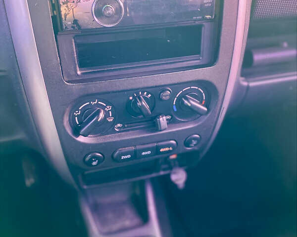 Черный Сузуки Джимни, объемом двигателя 1.33 л и пробегом 292 тыс. км за 5000 $, фото 2 на Automoto.ua