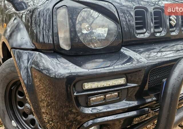 Черный Сузуки Джимни, объемом двигателя 1.33 л и пробегом 148 тыс. км за 8500 $, фото 10 на Automoto.ua