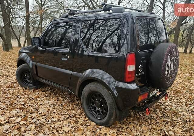 Черный Сузуки Джимни, объемом двигателя 1.33 л и пробегом 148 тыс. км за 8500 $, фото 7 на Automoto.ua