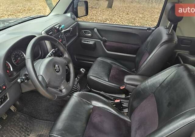 Черный Сузуки Джимни, объемом двигателя 1.33 л и пробегом 148 тыс. км за 8500 $, фото 18 на Automoto.ua