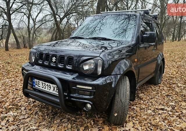 Черный Сузуки Джимни, объемом двигателя 1.33 л и пробегом 148 тыс. км за 8500 $, фото 2 на Automoto.ua