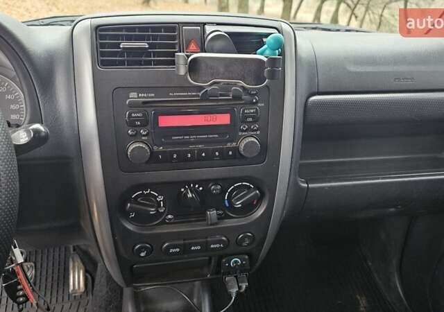 Черный Сузуки Джимни, объемом двигателя 1.33 л и пробегом 148 тыс. км за 8500 $, фото 16 на Automoto.ua