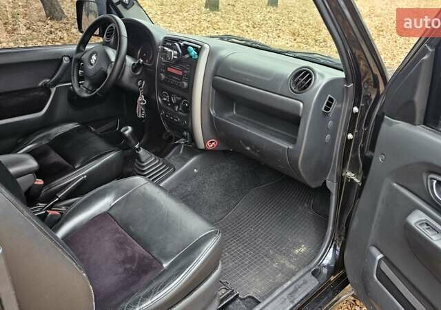 Черный Сузуки Джимни, объемом двигателя 1.33 л и пробегом 148 тыс. км за 8500 $, фото 20 на Automoto.ua