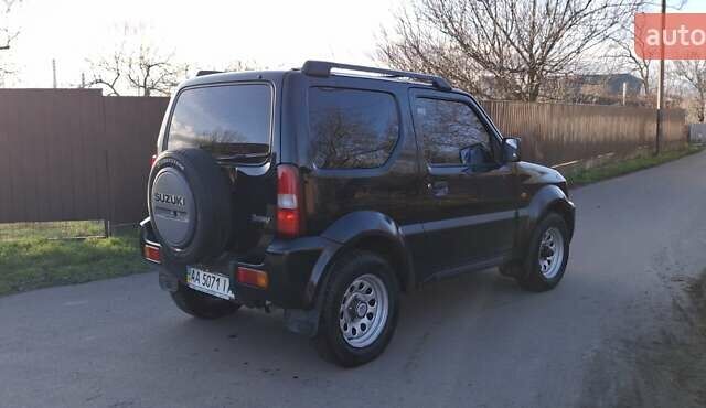 Черный Сузуки Джимни, объемом двигателя 1.3 л и пробегом 225 тыс. км за 6500 $, фото 6 на Automoto.ua