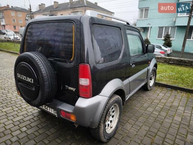Чорний Сузукі Джімні, об'ємом двигуна 1.3 л та пробігом 164 тис. км за 7450 $, фото 12 на Automoto.ua
