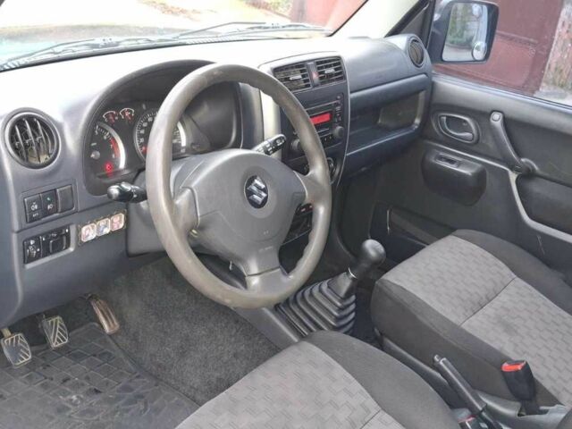 Черный Сузуки Джимни, объемом двигателя 1.3 л и пробегом 225 тыс. км за 6500 $, фото 11 на Automoto.ua