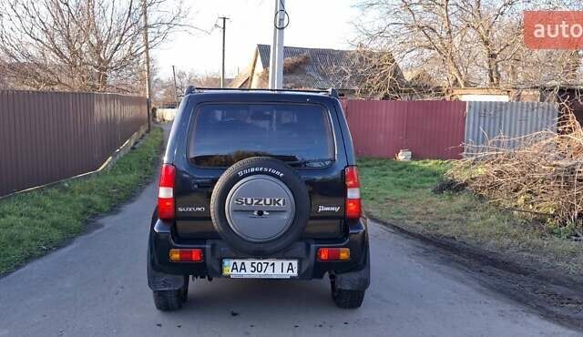 Черный Сузуки Джимни, объемом двигателя 1.3 л и пробегом 225 тыс. км за 6500 $, фото 7 на Automoto.ua