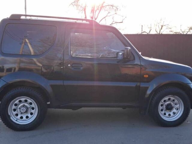 Черный Сузуки Джимни, объемом двигателя 1.3 л и пробегом 225 тыс. км за 6500 $, фото 5 на Automoto.ua