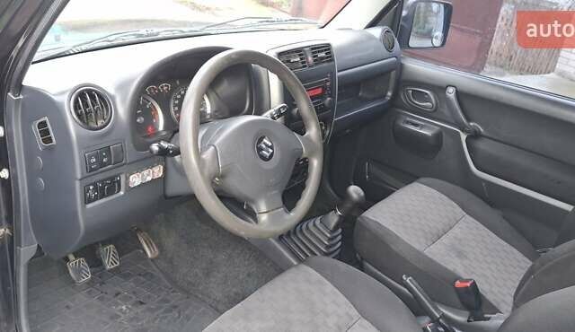 Черный Сузуки Джимни, объемом двигателя 1.3 л и пробегом 225 тыс. км за 6500 $, фото 11 на Automoto.ua