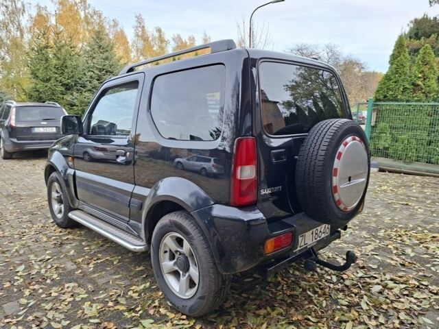 Черный Сузуки Джимни, объемом двигателя 1.5 л и пробегом 130 тыс. км за 1699 $, фото 6 на Automoto.ua