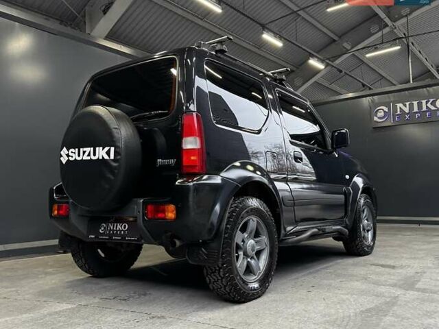 Черный Сузуки Джимни, объемом двигателя 1.33 л и пробегом 168 тыс. км за 12200 $, фото 18 на Automoto.ua