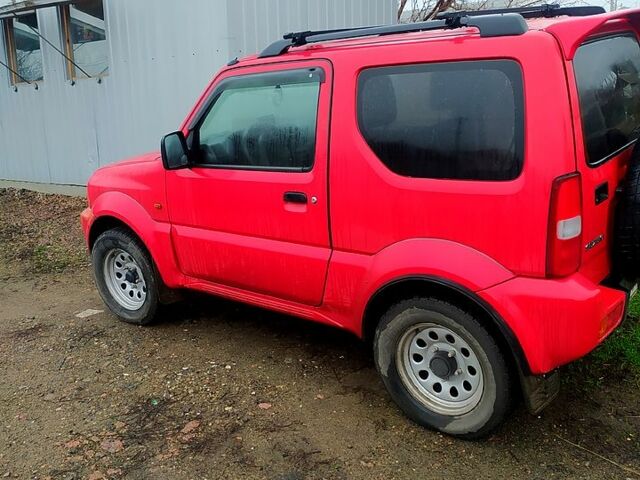 Красный Сузуки Джимни, объемом двигателя 1.3 л и пробегом 198 тыс. км за 7900 $, фото 1 на Automoto.ua