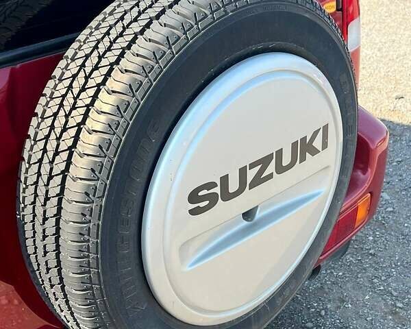 Сузуки Джимни 2008 в Ужгороде на Automoto.ua Красный Сузуки Джимни, объемом двигателя 1.3 л и пробегом 190 тыс. км за 7990 $, фото 9 на Automoto.ua
