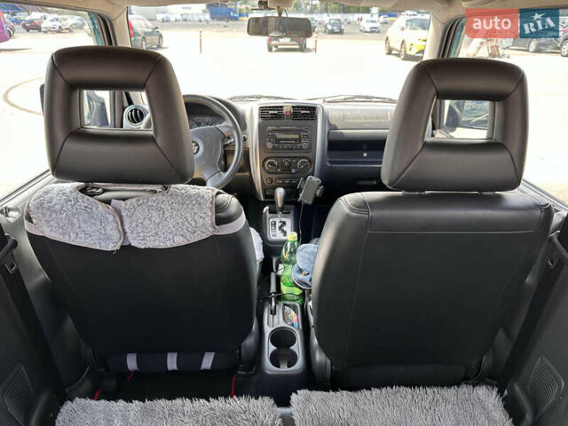 Красный Сузуки Джимни, объемом двигателя 1.33 л и пробегом 134 тыс. км за 9200 $, фото 6 на Automoto.ua