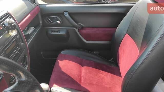 Червоний Сузукі Джімні, об'ємом двигуна 1.33 л та пробігом 108 тис. км за 8250 $, фото 8 на Automoto.ua