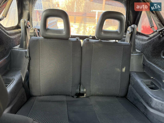 Сірий Сузукі Джімні, об'ємом двигуна 1.46 л та пробігом 117 тис. км за 12000 $, фото 13 на Automoto.ua