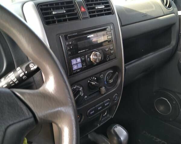 Серый Сузуки Джимни, объемом двигателя 1.3 л и пробегом 73 тыс. км за 11500 $, фото 2 на Automoto.ua