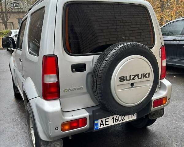 Серый Сузуки Джимни, объемом двигателя 1.33 л и пробегом 121 тыс. км за 8800 $, фото 4 на Automoto.ua