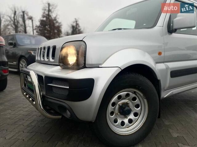 Серый Сузуки Джимни, объемом двигателя 1.33 л и пробегом 83 тыс. км за 11490 $, фото 4 на Automoto.ua