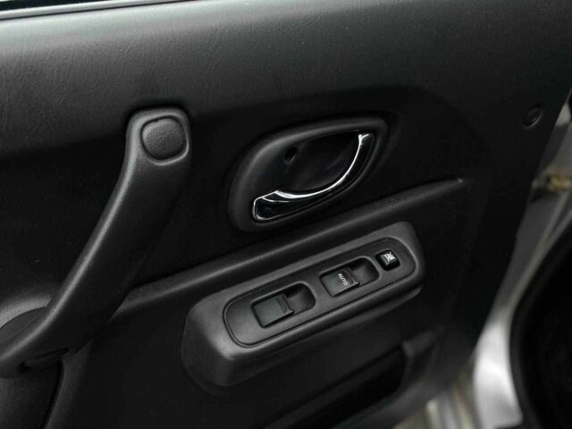 Серый Сузуки Джимни, объемом двигателя 1.3 л и пробегом 83 тыс. км за 11490 $, фото 11 на Automoto.ua