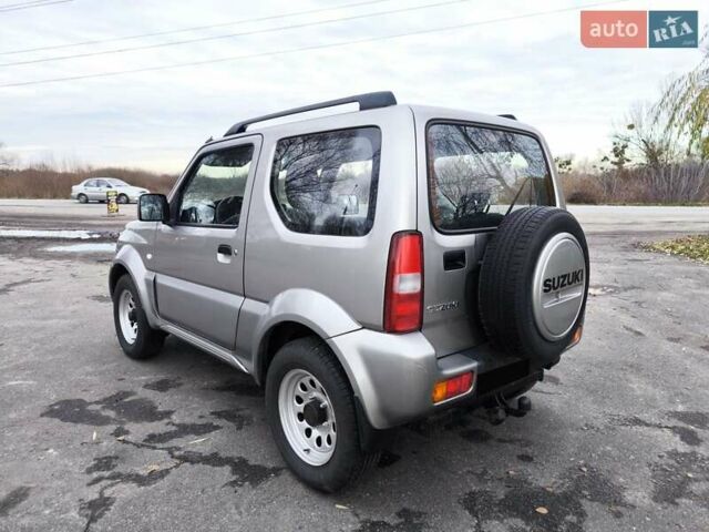 Серый Сузуки Джимни, объемом двигателя 1.3 л и пробегом 90 тыс. км за 13999 $, фото 4 на Automoto.ua