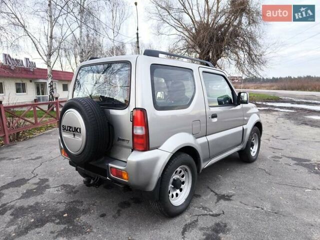 Серый Сузуки Джимни, объемом двигателя 1.3 л и пробегом 90 тыс. км за 13999 $, фото 3 на Automoto.ua