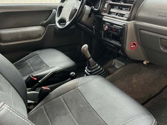 Синий Сузуки Джимни, объемом двигателя 1.3 л и пробегом 170 тыс. км за 7300 $, фото 7 на Automoto.ua