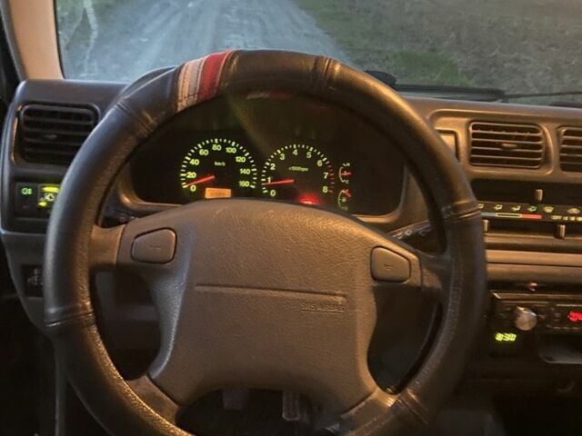 Зеленый Сузуки Джимни, объемом двигателя 1.3 л и пробегом 186 тыс. км за 6100 $, фото 6 на Automoto.ua