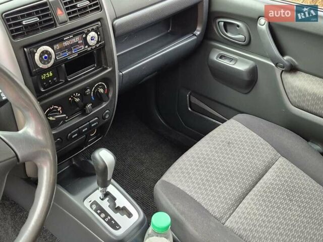 Зелений Сузукі Джімні, об'ємом двигуна 1.3 л та пробігом 170 тис. км за 8700 $, фото 15 на Automoto.ua