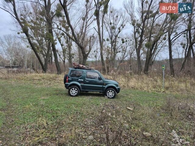 Зелений Сузукі Джімні, об'ємом двигуна 1.3 л та пробігом 170 тис. км за 8700 $, фото 11 на Automoto.ua