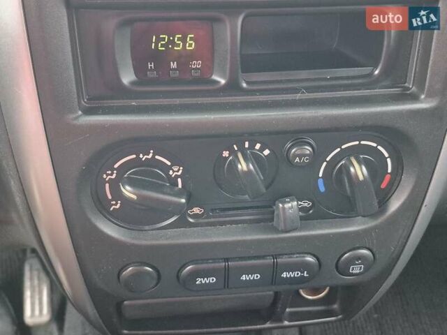 Зелений Сузукі Джімні, об'ємом двигуна 1.3 л та пробігом 170 тис. км за 8700 $, фото 16 на Automoto.ua