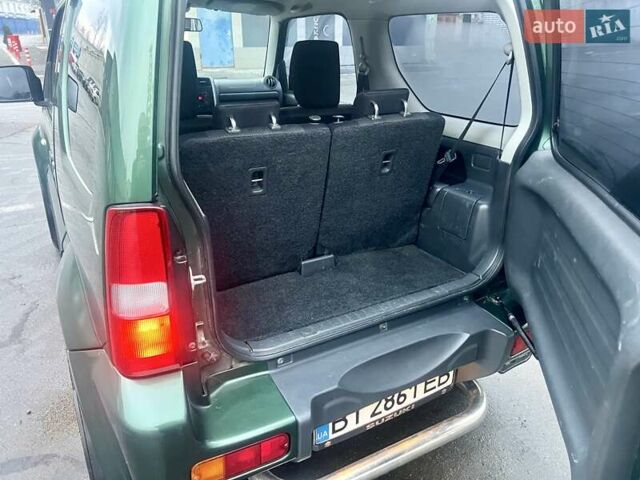 Зелений Сузукі Джімні, об'ємом двигуна 1.33 л та пробігом 112 тис. км за 12500 $, фото 13 на Automoto.ua