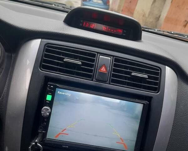 Черный Сузуки Лиана, объемом двигателя 1.59 л и пробегом 235 тыс. км за 3800 $, фото 12 на Automoto.ua