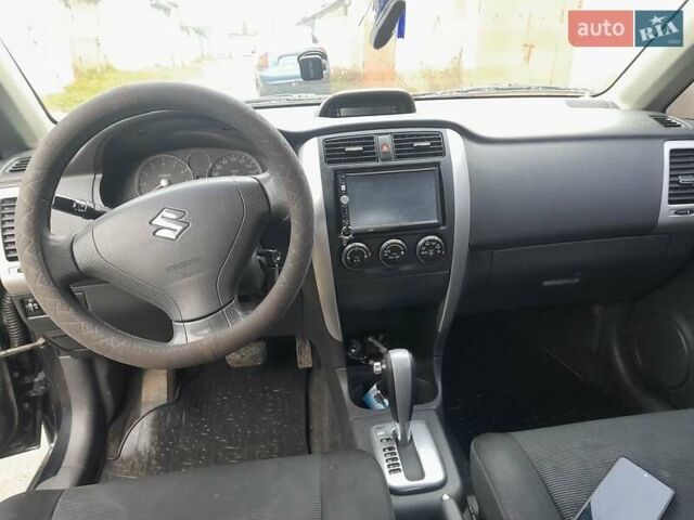Черный Сузуки Лиана, объемом двигателя 1.59 л и пробегом 235 тыс. км за 3800 $, фото 9 на Automoto.ua