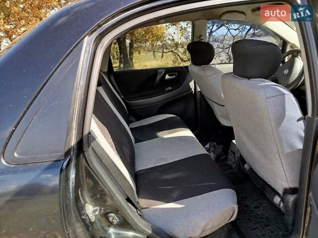 Черный Сузуки Лиана, объемом двигателя 1.6 л и пробегом 300 тыс. км за 3900 $, фото 7 на Automoto.ua