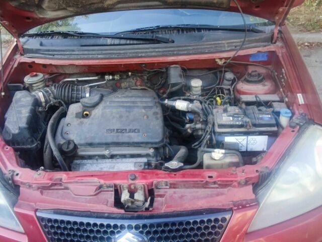 Червоний Сузукі Ліана, об'ємом двигуна 1.6 л та пробігом 390 тис. км за 2039 $, фото 1 на Automoto.ua