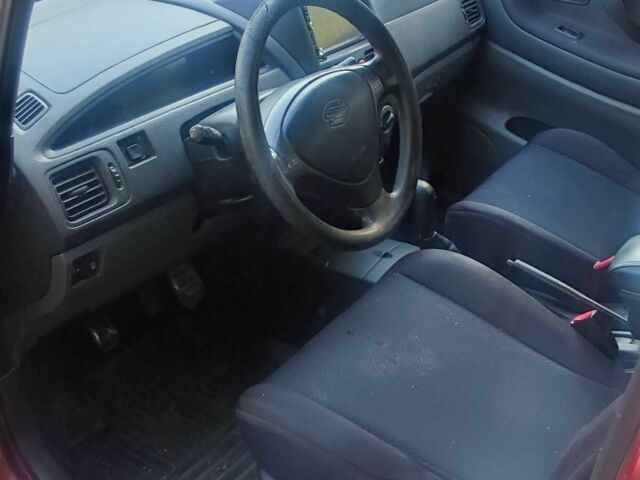 Червоний Сузукі Ліана, об'ємом двигуна 1.6 л та пробігом 390 тис. км за 2039 $, фото 2 на Automoto.ua