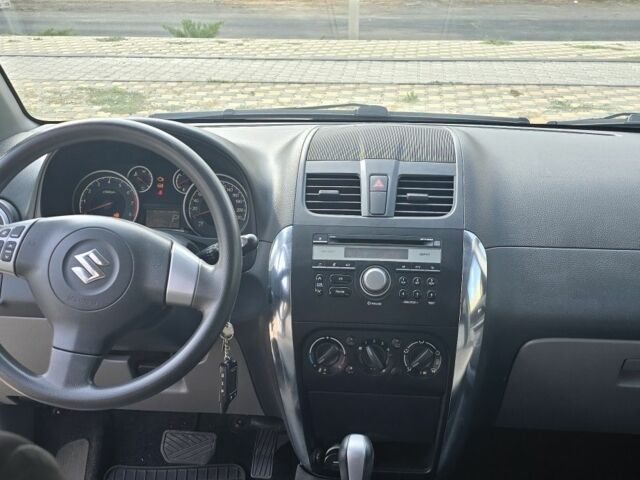 Белый Сузуки СХ4, объемом двигателя 1.6 л и пробегом 102 тыс. км за 10100 $, фото 5 на Automoto.ua