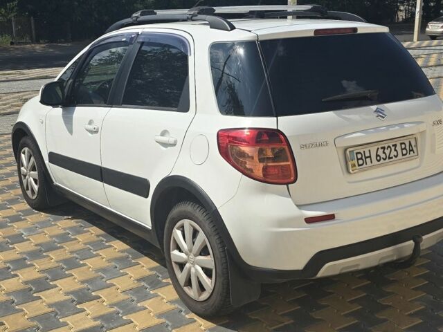 Белый Сузуки СХ4, объемом двигателя 1.6 л и пробегом 102 тыс. км за 10100 $, фото 4 на Automoto.ua