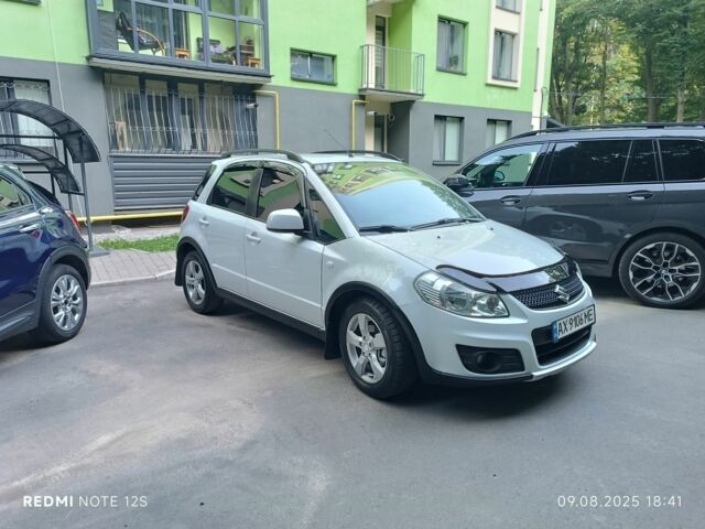 Белый Сузуки СХ4, объемом двигателя 1.6 л и пробегом 125 тыс. км за 9400 $, фото 1 на Automoto.ua