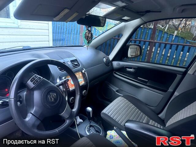 Белый Сузуки СХ4, объемом двигателя 1.6 л и пробегом 170 тыс. км за 7500 $, фото 3 на Automoto.ua