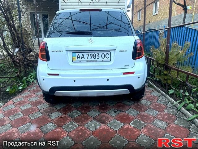 Белый Сузуки СХ4, объемом двигателя 1.6 л и пробегом 170 тыс. км за 7500 $, фото 1 на Automoto.ua